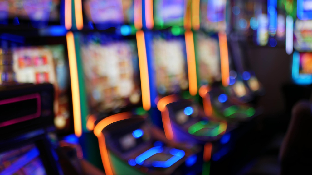 defocused slot machines glow casino las vegas usa illuminated neon gambling slots