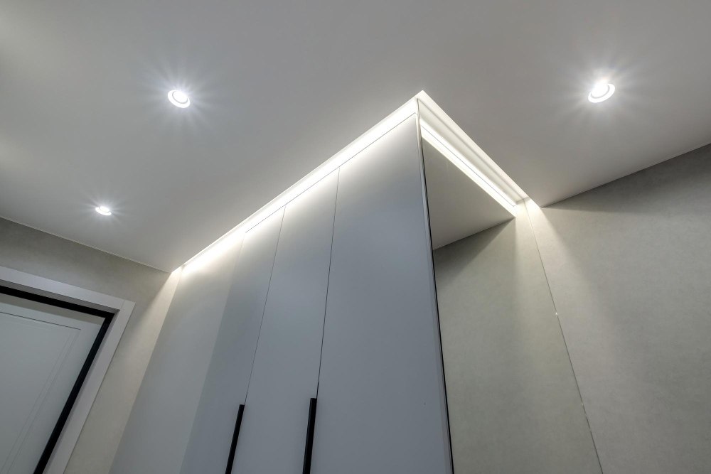 suspended ceiling with halogen spots lamps drywall construction empty room apartment house stretch ceiling white complex shape 1