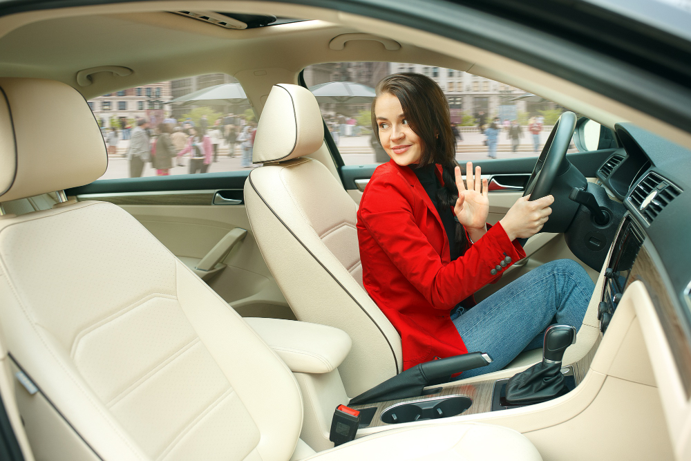 driving around city young attractive woman driving car young pretty caucasian model elegant stylish red jacket sitting modern vehicle interior